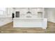 Bright kitchen features white cabinetry, a large island, and stainless steel appliances at 5661 Stetson Dr, Whitestown, IN 46052