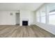 Bright living room with fireplace, hardwood flooring, and lots of natural light at 5661 Stetson Dr, Whitestown, IN 46052