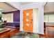 Entryway with tile floor, wooden door with glass inserts, and adjacent rooms at 5715 N Meridian St, Indianapolis, IN 46208