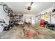 Garage with shelving, lawn equipment, and overhead lighting at 5715 N Meridian St, Indianapolis, IN 46208
