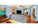 Bright and airy living room with hardwood floors, fireplace, and a large gray sofa at 5715 N Meridian St, Indianapolis, IN 46208