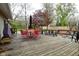 Spacious backyard features a wooden deck, fire pit, and seating area, creating an inviting outdoor retreat at 601 E 95Th St, Indianapolis, IN 46240