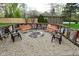 Backyard fire pit with gravel and seating, perfect for relaxing evenings at 601 E 95Th St, Indianapolis, IN 46240
