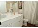 Bathroom featuring a classic white vanity, framed mirror, and decorative accents at 601 E 95Th St, Indianapolis, IN 46240