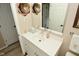Bright bathroom with modern vanity, stylish mirror, and decorative wall accents at 601 E 95Th St, Indianapolis, IN 46240