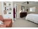 Bedroom featuring a cozy armchair and an open doorway at 601 E 95Th St, Indianapolis, IN 46240