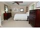 Spacious bedroom with two dressers and a large window overlooking a peaceful outdoor scene at 601 E 95Th St, Indianapolis, IN 46240