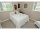 Bright bedroom with cozy decor, natural light, and neutral carpet flooring at 601 E 95Th St, Indianapolis, IN 46240