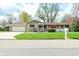 Charming single-story home with a well-manicured lawn and an attached two-car garage in a quiet neighborhood at 601 E 95Th St, Indianapolis, IN 46240