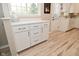 Bright eat-in kitchen features all white cabinetry and modern hardware at 601 E 95Th St, Indianapolis, IN 46240