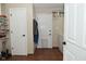 Spacious laundry room with white cabinets, multiple doors, washer, and dryer at 601 E 95Th St, Indianapolis, IN 46240