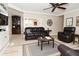Comfortable living room featuring stylish leather seating, a ceiling fan, and bright, neutral walls at 601 E 95Th St, Indianapolis, IN 46240