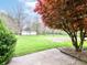 Expansive backyard featuring lush green grass, mature trees, and a charming white storage shed at 6113 N 250 E, Greenfield, IN 46140