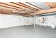 Spacious basement with painted walls, shelving and concrete floor at 6113 N 250 E, Greenfield, IN 46140