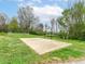 Outdoor basketball court with fencing surrounded by a lush green landscape at 6113 N 250 E, Greenfield, IN 46140