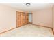 Neutral bedroom featuring carpet flooring, painted trim and a closet at 6113 N 250 E, Greenfield, IN 46140