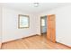 Neutral bedroom featuring a window, hardwood floors, painted trim and closet at 6113 N 250 E, Greenfield, IN 46140