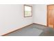 This bedroom features neutral paint, gray carpet, and a closet at 6113 N 250 E, Greenfield, IN 46140