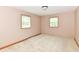Neutral bedroom featuring two windows, carpet flooring, painted trim at 6113 N 250 E, Greenfield, IN 46140
