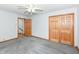 Neutral bedroom featuring carpet flooring, ceiling fan, painted trim and a closet at 6113 N 250 E, Greenfield, IN 46140