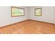 Bright bedroom with hardwood floors and natural light streaming through the windows at 6113 N 250 E, Greenfield, IN 46140