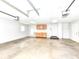 This garage has two automatic garage doors and built-in cabinets at 6113 N 250 E, Greenfield, IN 46140