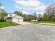 Detached two-car garage with ample parking space on a gravel driveway at 6113 N 250 E, Greenfield, IN 46140
