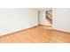 Bright living room with hardwood floors and staircase access adds charm and functionality at 6113 N 250 E, Greenfield, IN 46140