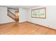 Spacious living room featuring hardwood floors and staircase at 6113 N 250 E, Greenfield, IN 46140