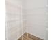 Spacious walk-in pantry featuring white wire shelving for optimal storage and organization in this modern home at 6204 Fairview Dr, McCordsville, IN 46055