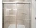 Modern bathroom shower stall with glass door and gray tile at 6204 Fairview Dr, McCordsville, IN 46055