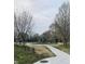 Outdoor playground with modern equipment and scenic walking path at 644 Warren Ave, Indianapolis, IN 46221