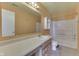 Functional bathroom featuring a vanity with sink, mirror, and a shower-tub combo at 6534 Redland Way, Indianapolis, IN 46217