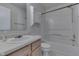 Clean, all-white bathroom featuring a vanity, toilet, and shower-tub combination at 6534 Redland Way, Indianapolis, IN 46217