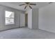 Sunlit bedroom featuring a ceiling fan and a window overlooking the outdoors at 6534 Redland Way, Indianapolis, IN 46217