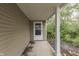 Exterior view of the entryway of a home featuring a covered porch and supported by white columns at 6534 Redland Way, Indianapolis, IN 46217