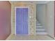 Interior entryway with an open staircase, featuring a unique purple door at 6534 Redland Way, Indianapolis, IN 46217