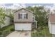 Charming two-story home featuring a front-facing two car garage and a well-manicured lawn at 6534 Redland Way, Indianapolis, IN 46217