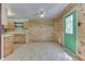 Bright living room with wood-paneled walls and a charming, light green front door at 6534 Redland Way, Indianapolis, IN 46217