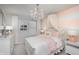 Charming bedroom with a chandelier, canopy bed, white furniture, and a delightful, elegant design at 6801 Seabiscuit Rd, Whitestown, IN 46075