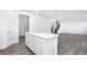 Open floor plan showcasing a kitchen island, staircase and the living area at 6801 Seabiscuit Rd, Whitestown, IN 46075