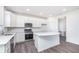 Modern kitchen featuring a stainless steel range, built-in microwave, and white countertops at 6801 Seabiscuit Rd, Whitestown, IN 46075
