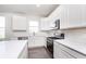 Contemporary kitchen featuring white cabinetry, stainless steel appliances, and a center island at 6801 Seabiscuit Rd, Whitestown, IN 46075