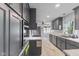 Modern kitchen features sleek, gray cabinetry, recessed lighting, stainless steel appliances and marble countertops at 7104 Combs Rd, Indianapolis, IN 46237