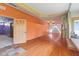 Bright room featuring hardwood floors, and a doorway leading to another room at 7104 Combs Rd, Indianapolis, IN 46237
