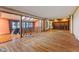 Open living space with beautiful wood floors, unique architectural details, and abundant natural light at 7104 Combs Rd, Indianapolis, IN 46237
