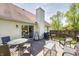 Well-maintained back deck featuring an outdoor dining set, lounge chair, and grill, ideal for gatherings at 7114 Hickory Rd, Indianapolis, IN 46259