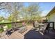 Inviting back deck with outdoor seating and dining area, surrounded by lush greenery at 7114 Hickory Rd, Indianapolis, IN 46259
