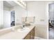 Bathroom vanity featuring a sink, mirror, vanity lighting, and storage at 7114 Hickory Rd, Indianapolis, IN 46259