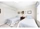 Bright bedroom showcasing twin beds with matching blue bedding and ample closet space at 7114 Hickory Rd, Indianapolis, IN 46259